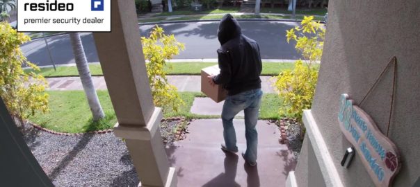 person stealing package from front porch