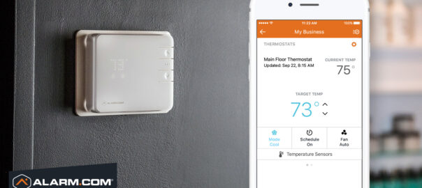 A phone showing smart thermostat controls for business energy management