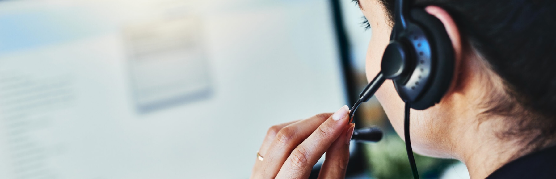 Rearview shot of a young woman working in a call center